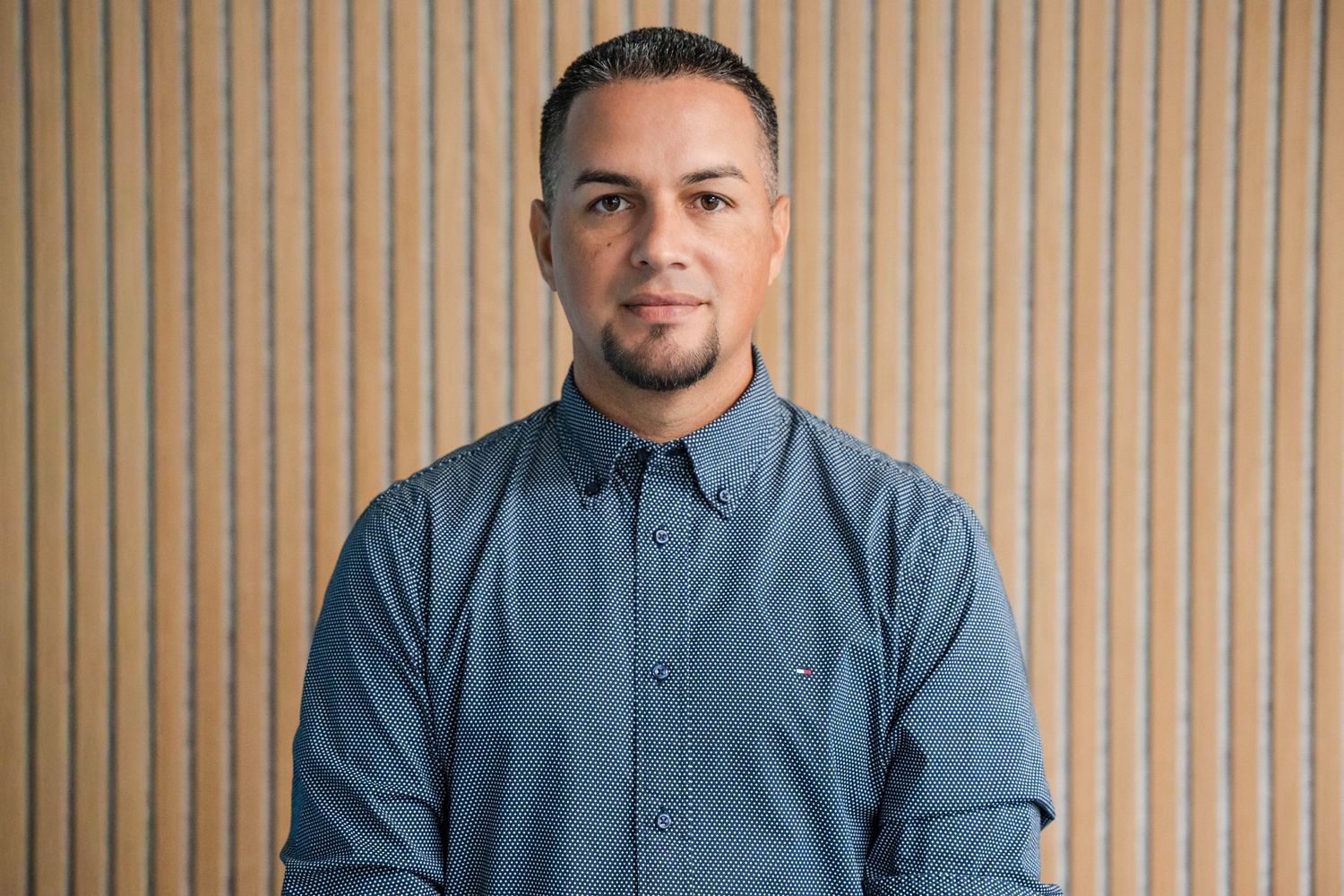 Professional portrait against a wood background