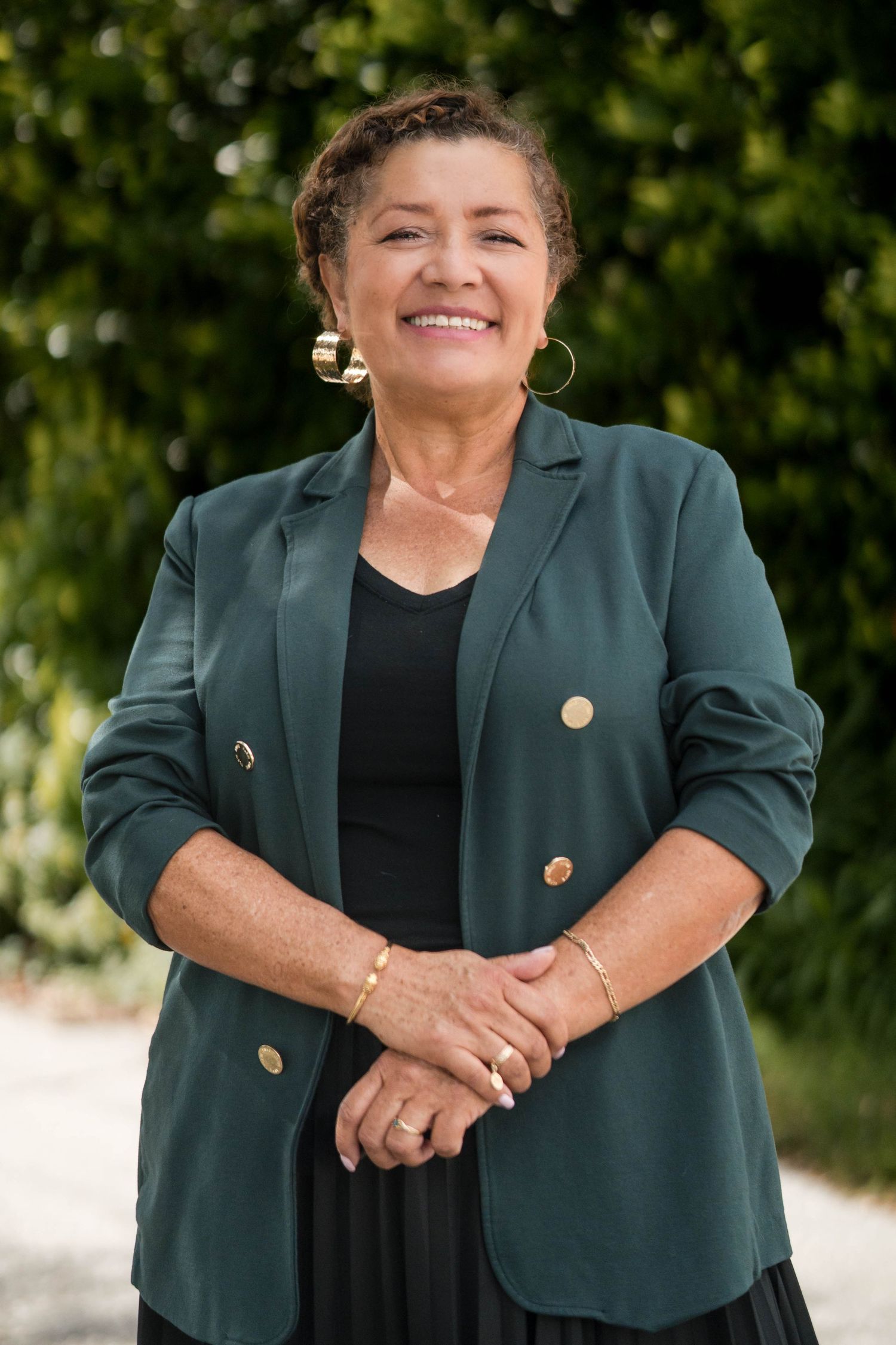 Environmental professional portrait in a green jacket
